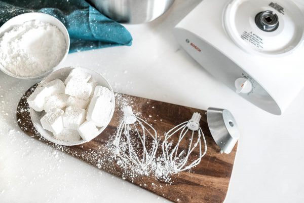 Wire Whips on a kitchen counter next to marshmallows and a bosch universal plus mixer