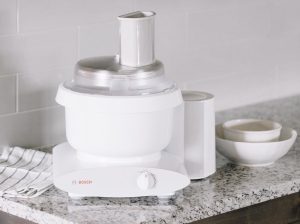 L'chef Large Slicer Shredder Attachment on a Bosch Universal Plus in a kitchen