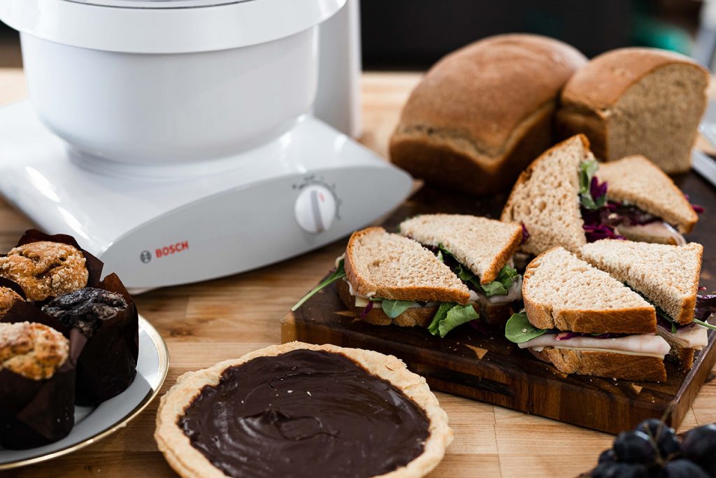 Bosch mixer with turkey sandwiches made from homemade whole wheat bread.