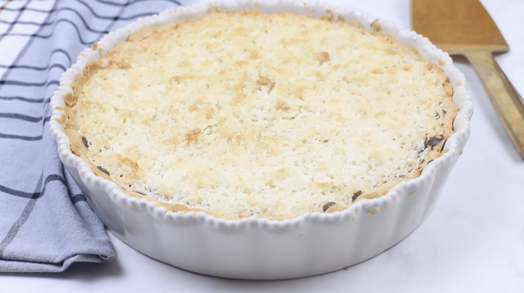 Coconut chocolate tart, in a tart pan.